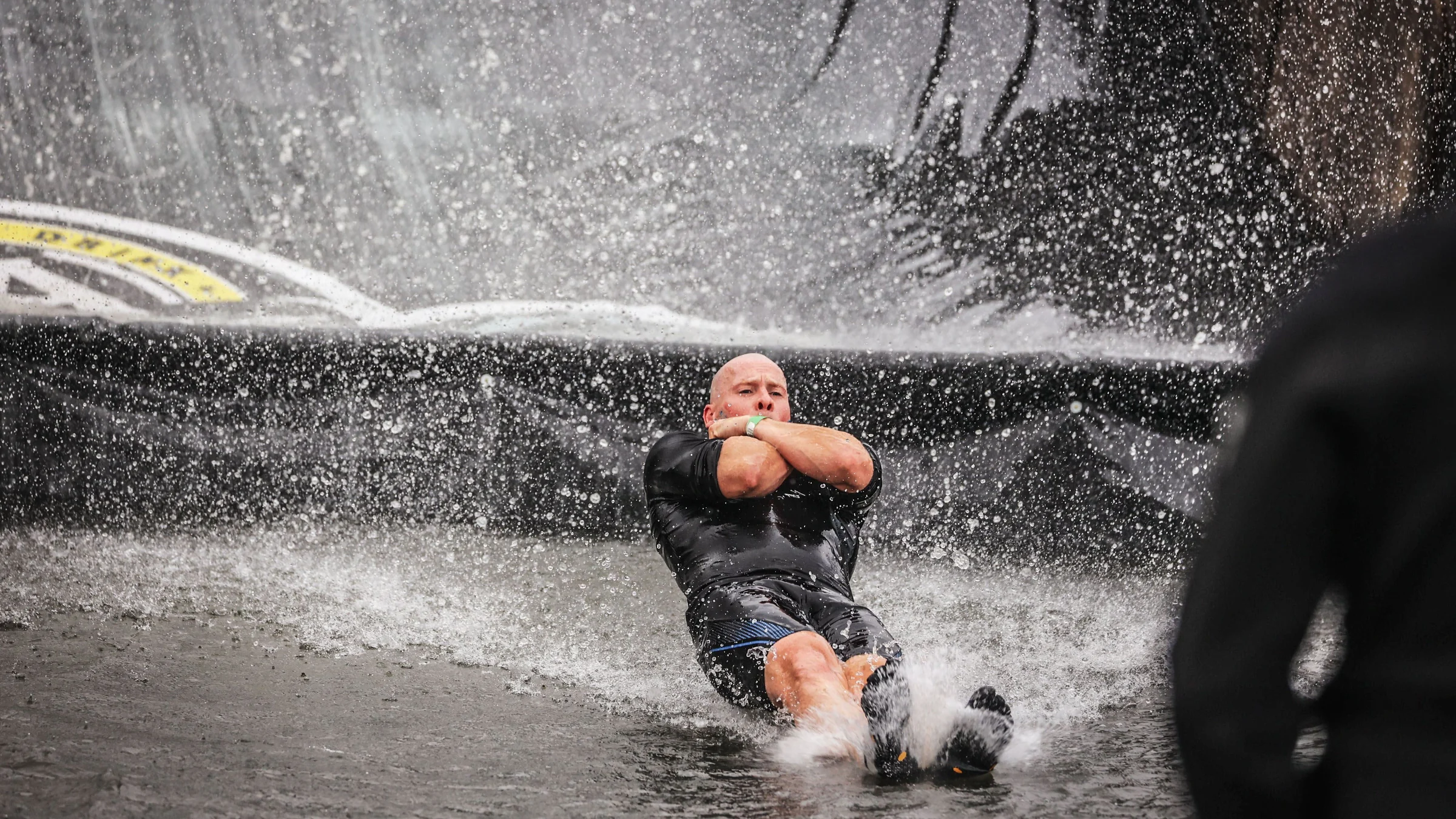 Bjorn descending the water slide during the 2023 Spartacus Run in Boom